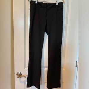 Women’s black dress pants.